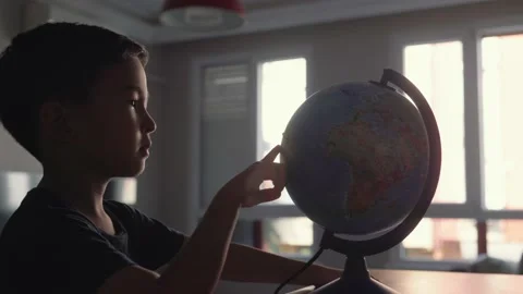 Cute Preschooler explores countries on the globe Stock Footage 204071652