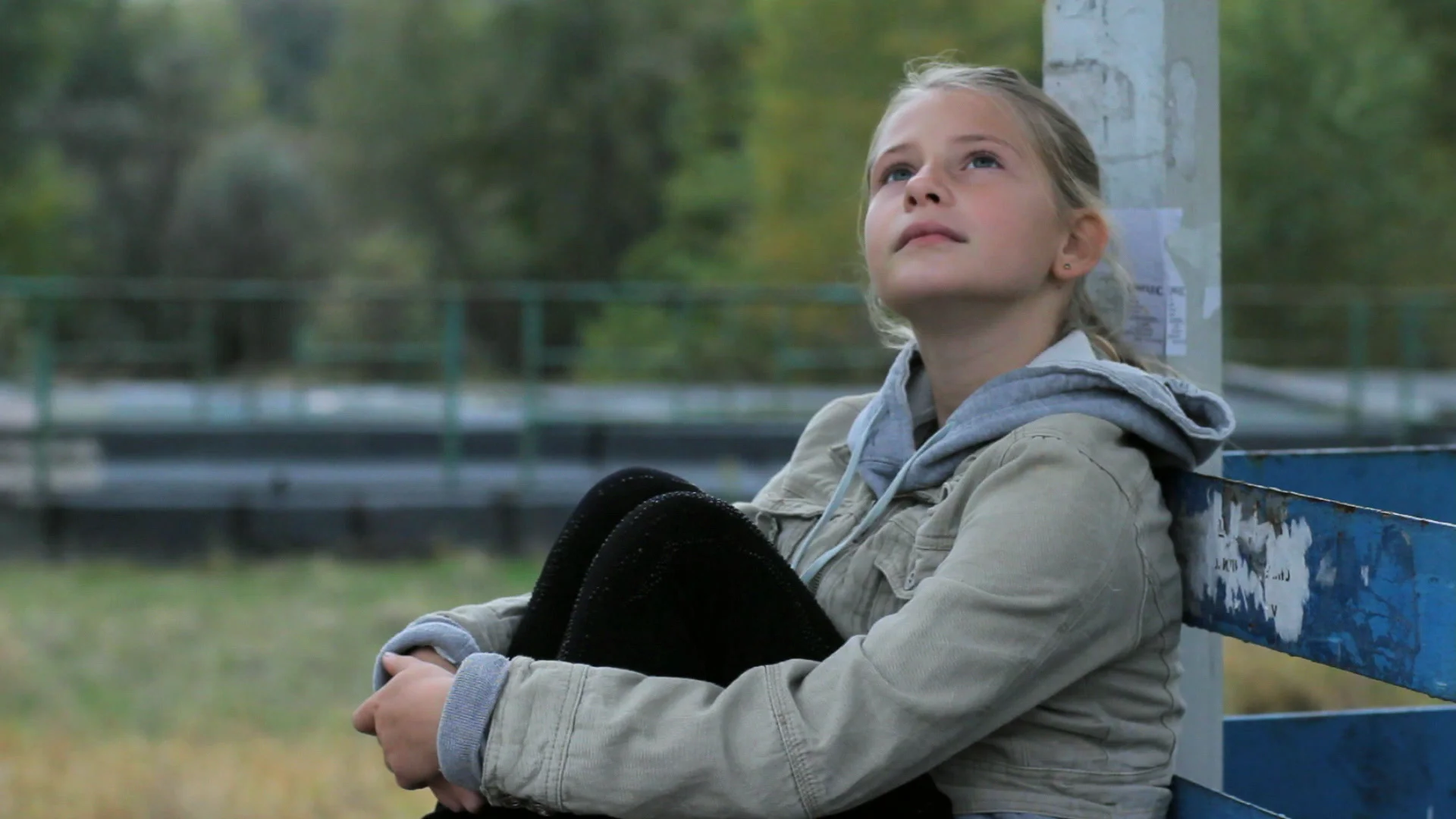 cute preteen cute preteen girl watching TV on couch using remote control ...