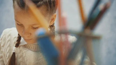 Cute pupil choosing appropriate colored pencil. Stock Footage 113070677