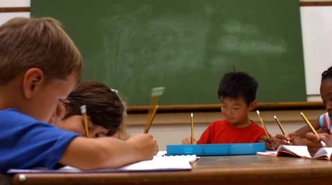 Cute pupils in classroom at school Stock Footage 47473122