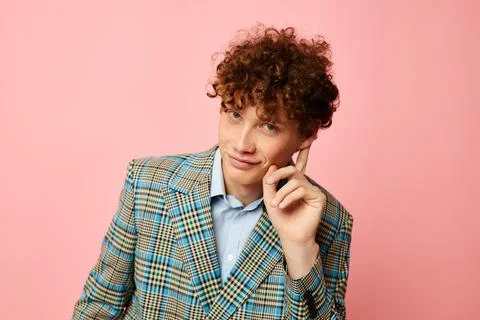 Cute red-haired guy checkered blazer elegant style posing fashion pink Stock Photos