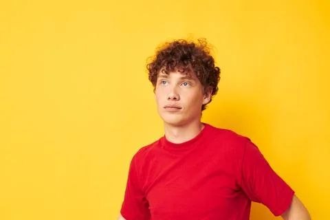 Cute red-haired guy posing with a white mug and in the hands of a drink Foto stock