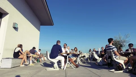 Cute rooftop coffee shop and people enjoying the bright hot sun in the weekend Stock Footage 103285802