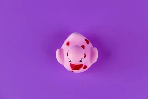 Cute Rubber Duck with Heart Patterns on Purple Background - A Whimsical Addition Stock Photos