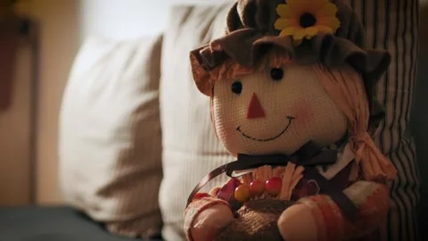 Cute Scarecrow sitting on bench Stock Footage 286179110