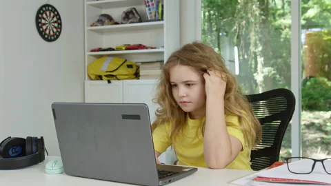 Cute school student with laptop in class. Child online learning with laptop at Stock Footage 346712282