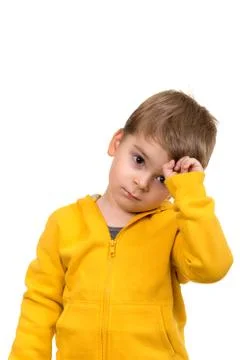 Cute schoolboy thinking idea while wearing glasses and looking at up, isolated Stock Photos
