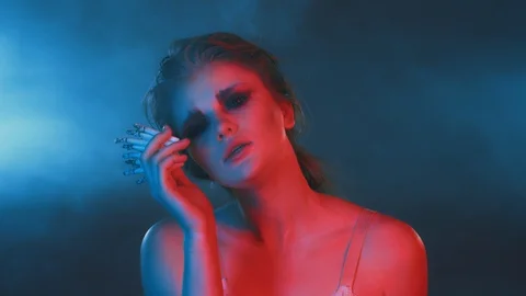 Cute sexy chick with bunch of cigarettes in hand, nicotine overdose, neon light Stock Footage 125070822
