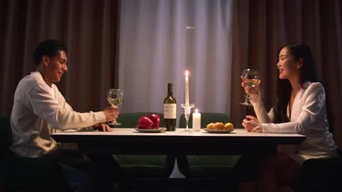 Cute shy couple on first date. Romantic dinner night at home. Love celebration. Stock Footage 327715338