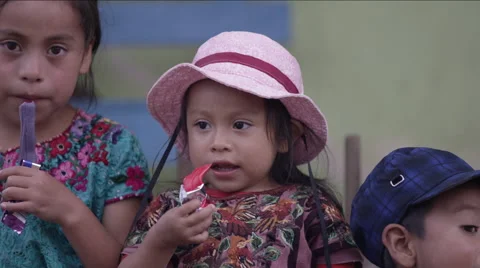 Cute siblings having chocolate together, Guatemala Stock Footage 63054679