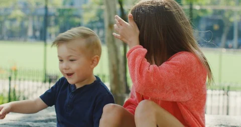 Cute siblings interacting with each other in the park Stock Footage 116116724