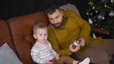 Cute small boy with his dad are playing with old clock. Father and son Stock Footage 120541249