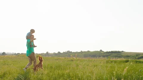 Cute small boy on the his dad back running and playing together with their cute Video stock 166841768