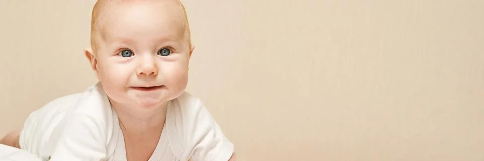 Cute small boy lying at bed. Childhood concept Stock Photos
