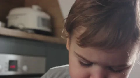 Cute small boy portrait in the kitchen on a sunny day Vídeos de archivo 123072934