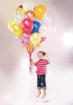 Cute small kid hovering by the ballons Stock Photos