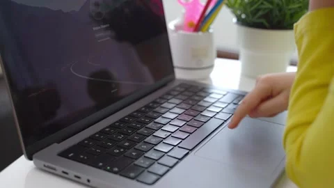 Cute smart caucasian primary School Child typing on the keyboard laptop. Online Stock Footage 234715958