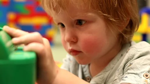 Cute smart little boy playing concentrated face expression slow motion calm Stock Footage 112704054
