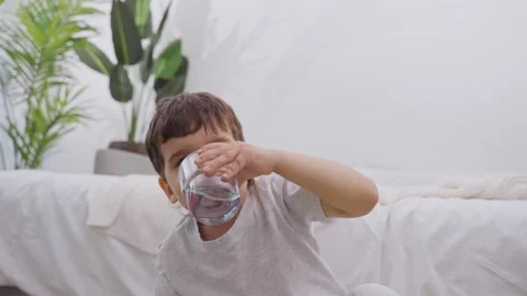 Cute Smiling Child Drinking Water Stock Footage 244542063