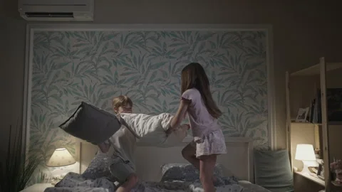 Cute smiling children having fun in bedroom. Stock Footage 164729906