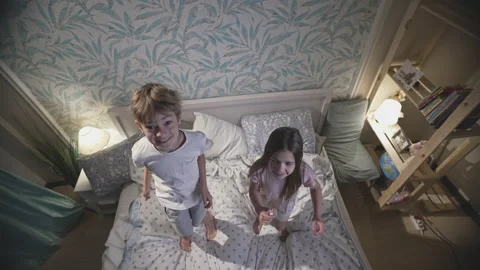 Cute smiling children having fun in bedroom. Stock Footage 165066250
