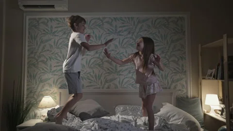 Cute smiling children having fun in bedroom. Stock Footage 166314475