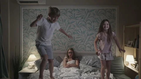 Cute smiling children having fun in bedroom. Stock Footage 166323546