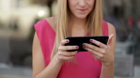 Cute smiling lady using fashionable digital tablet on the street Stock Footage 59831119