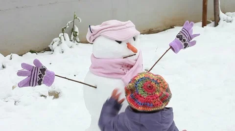 Cute snowman with child Stock Footage 10739565