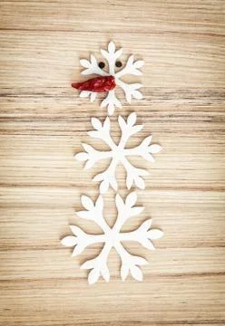 Cute snowman made of snow flakes and chili pepper, symbol of winter Stock Photos
