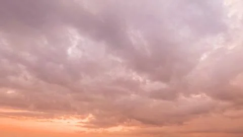 Cute sundown gold clouds on the sky background - photo of nature Stock Photos