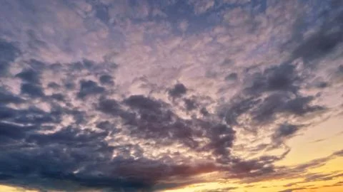 Cute sundown golden clouds on the sky background - photo of nature Stock Photos