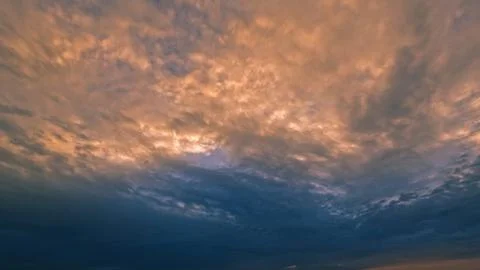 Cute sunset gold clouds on the sky backdrop - photo of nature Stock Photos
