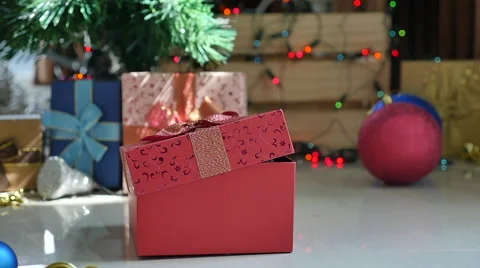 Cute tabby kitten playing in a gift box with Christmas decoration,slow motion Stock Footage 68899233