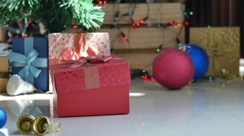 Cute tabby kitten playing in a gift box with Christmas decoration Stock Footage 68899893