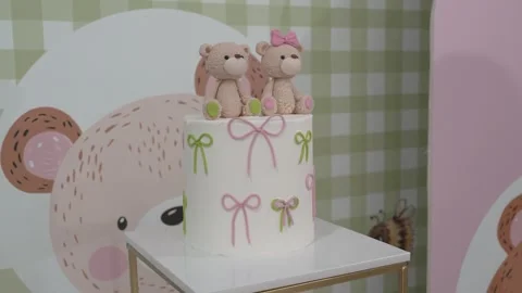 Cute teddy bear cake for a birthday celebration at a festive party in a Stock Footage 334012716