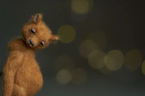 Cute teddy bear isolated on light background. Holiday glowing backdrop. Def.. Stock Photos