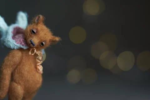 Cute teddy bear isolated on light background. Holiday glowing backdrop. Def.. Stock Photos