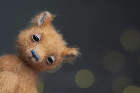 Cute teddy bear isolated on light background. Holiday glowing backdrop. Def.. Stock Photos