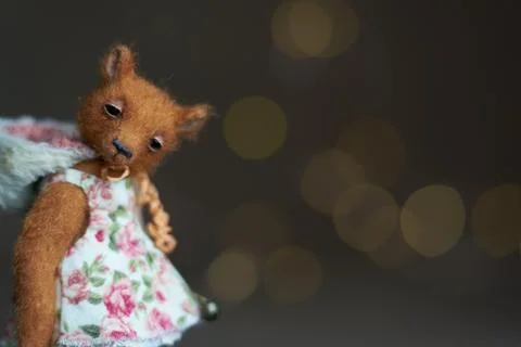 Cute teddy bear isolated on light background. Holiday glowing backdrop. Def.. Stock Photos