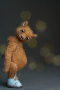 Cute teddy bear isolated on light background. Holiday glowing backdrop. Def.. Stock Photos