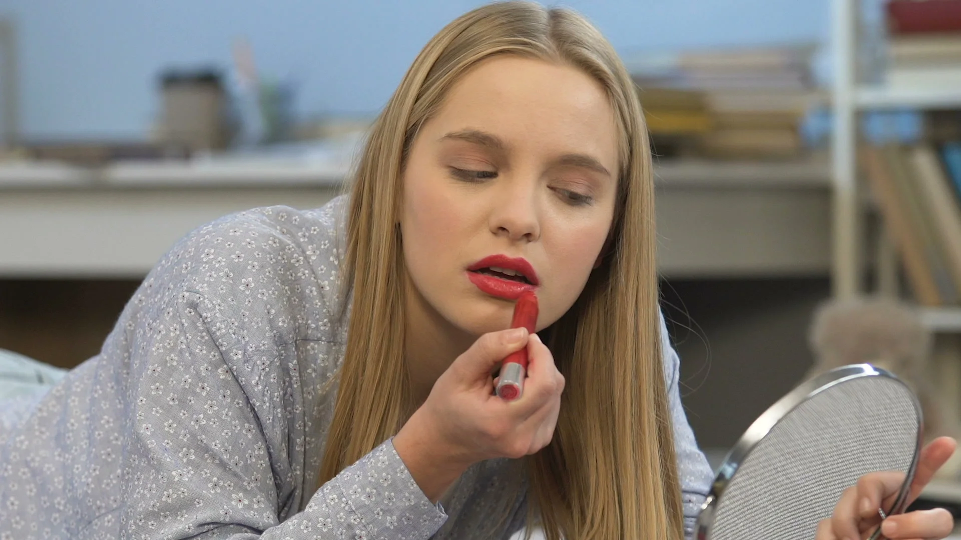 Teenage Girl Applying Lipstick