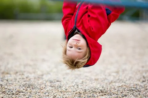 Cute toddler boy, playing on the playground Stock Photos