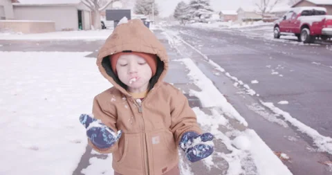 Cute Toddler Eating Snow in Albuquerque New Mexico Stock Footage 345272553