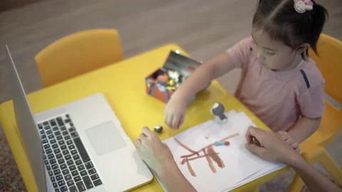 Cute toddler learning to tidy up Stock Footage 158975784