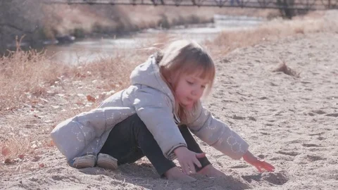 Cute Toddler Playing in the Sand Stock Footage 84144323