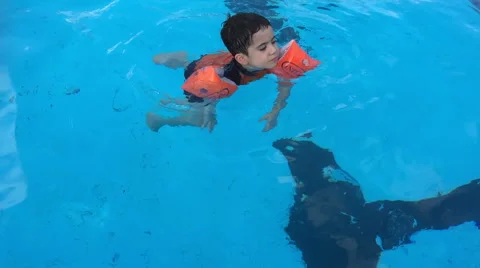 Cute toddler in the pool Stock Footage 53879926