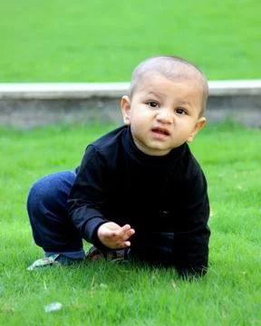 A cute toddler is posing with a style. Stock Photos