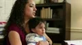 Cute toddler sitting with work at home mom HD Footage