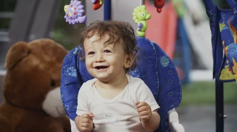 Cute Toddler on a Swing Видео 49732175